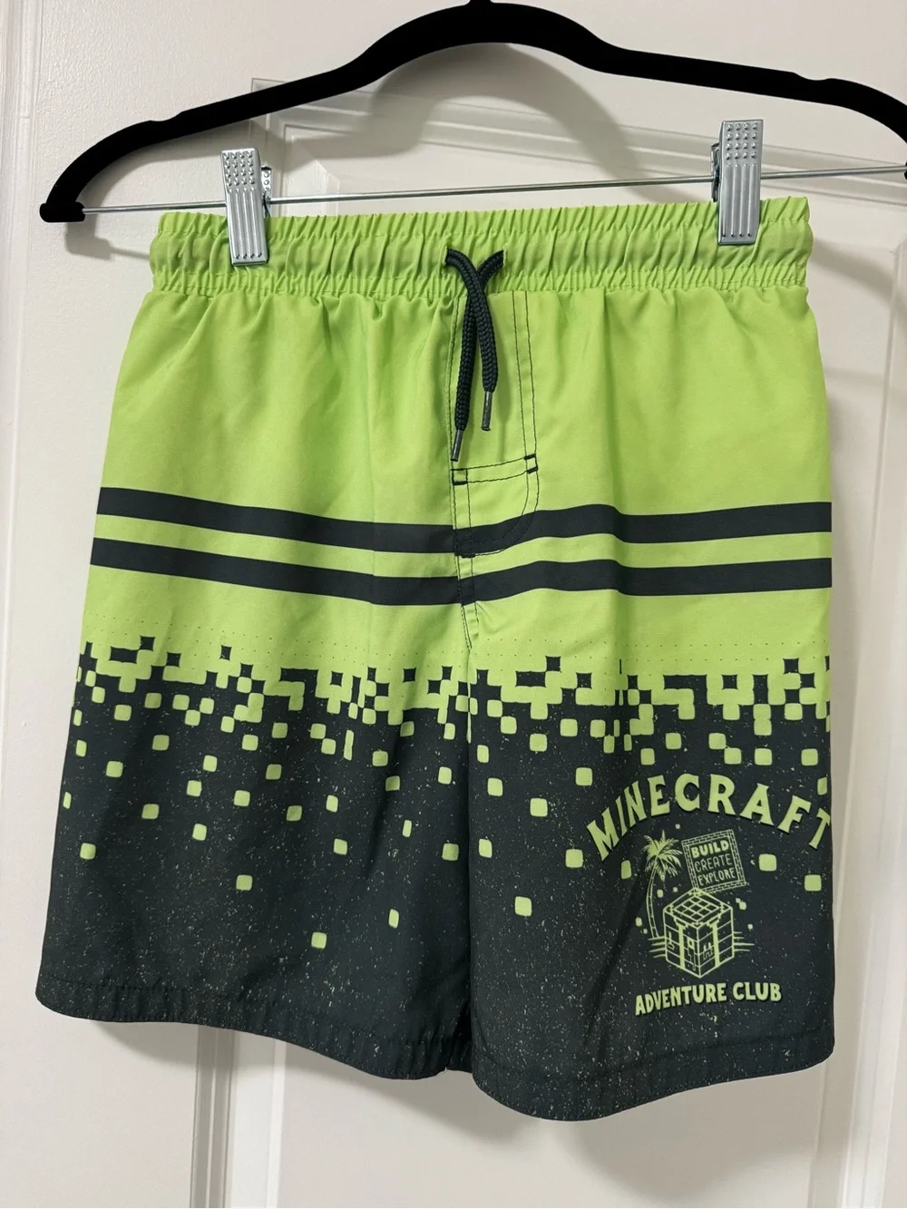 Boy’s Lime Green and Black Adventure Club Swim Shorts. Good condition.